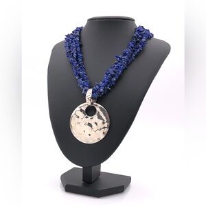 Vintage lapis lazuli stone necklace with sterling silver pendant.